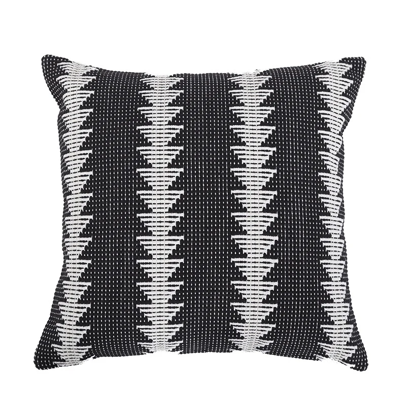 Quadratischer gewebter Zierkissenbezug im Tribal-Jacquard mit Bommel-Ecken