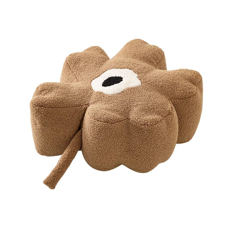 Blumenförmiger Bodensitzpouf mit Bouclé‑Bezug und segmentierter Polsterung