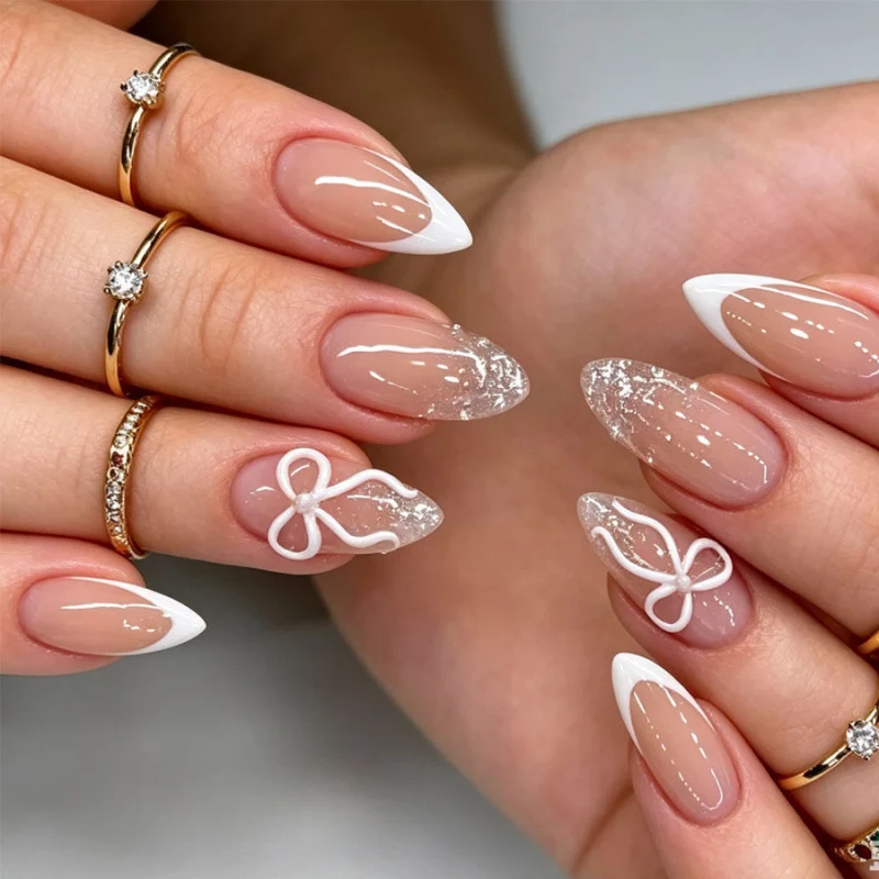 Elegante Press-On Nagelset mit Schleife und Glitzerakzenten