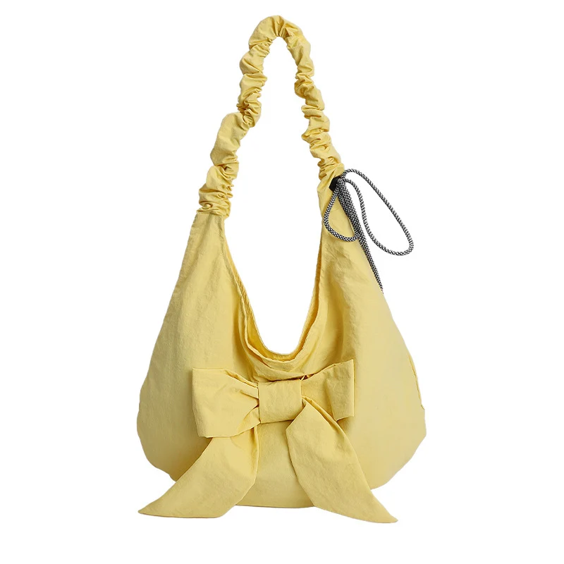 Schultertasche mit Schleifenverzierung