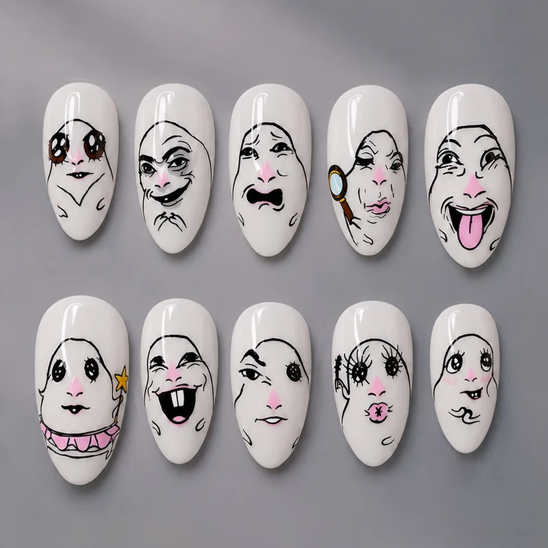 Kreatives Kunstnagelset mit Gesichtsmotiven Karnz