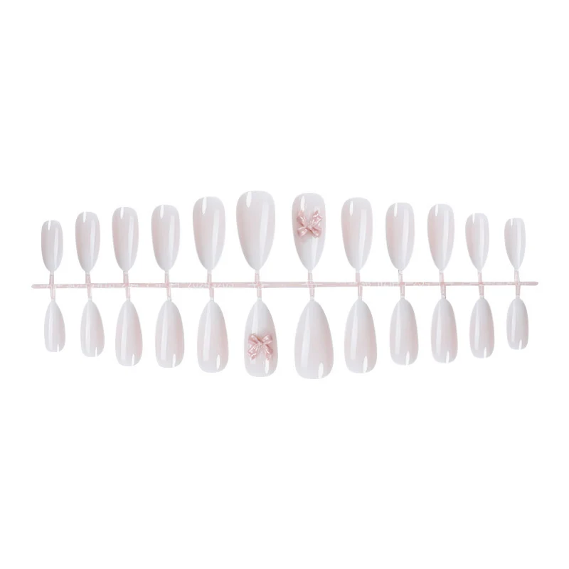 Elegantes Kunstnagelset mit luxuriösem Ombre-Effekt und zarten Schleifenakzenten Karnz