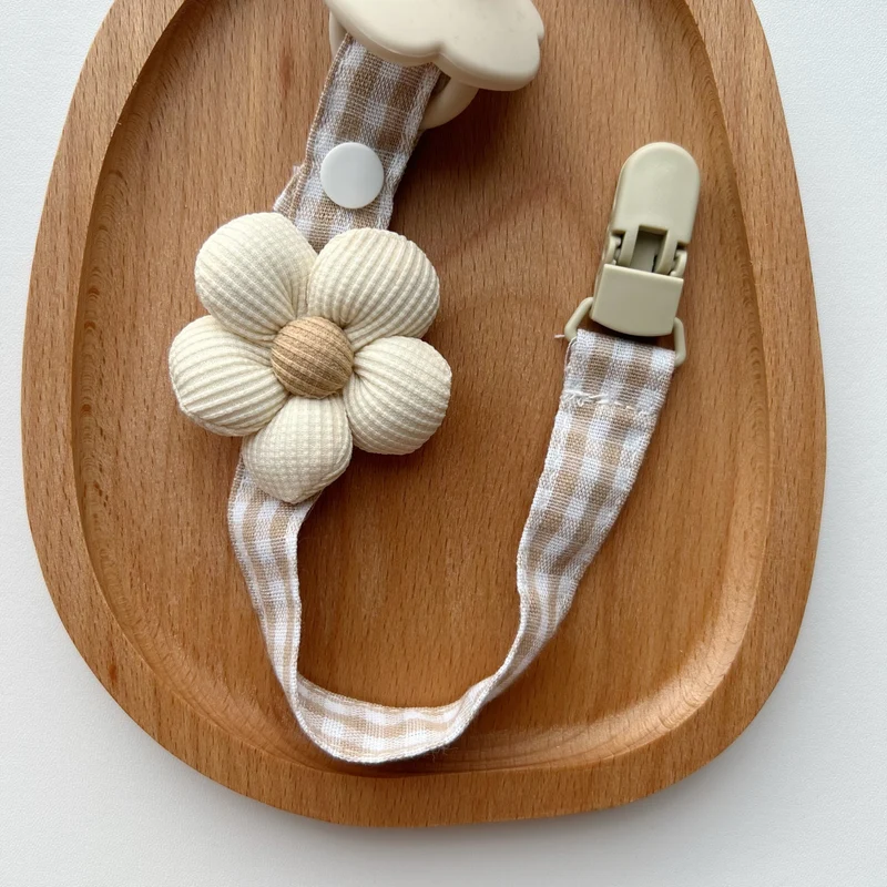 Blumenkleidungs-Schnullerclip mit Gingham-Baumwollgurt