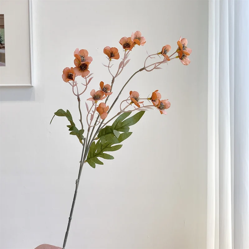 Dekorativer künstlicher Blumenzweig