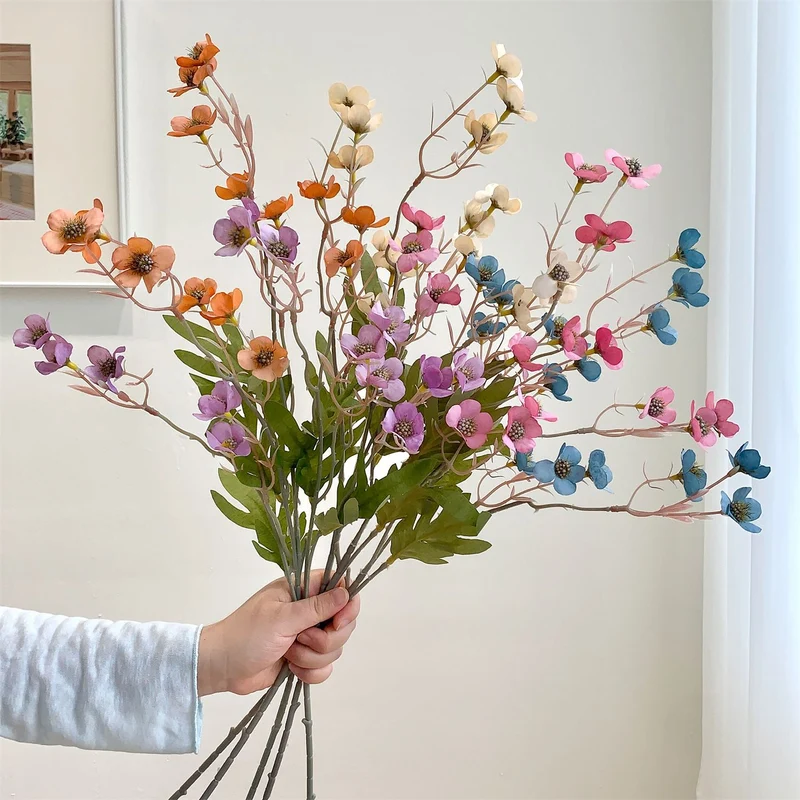 Dekorativer künstlicher Blumenzweig
