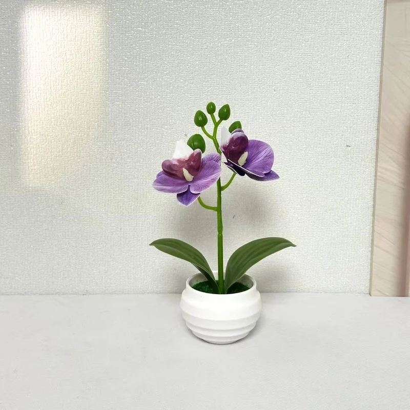 Lebensechte dekorative Orchideenpflanzenarrangement für die Wohnkultur