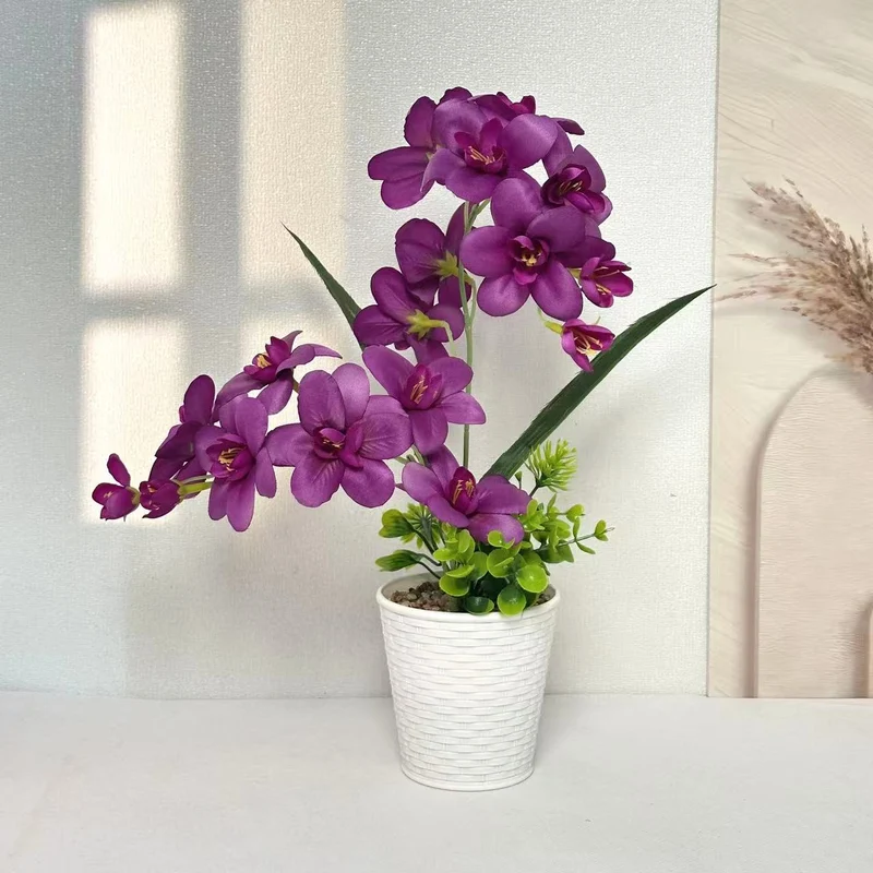Künstliche Orchideenpflanzenanordnung für die Innendekoration zuhause