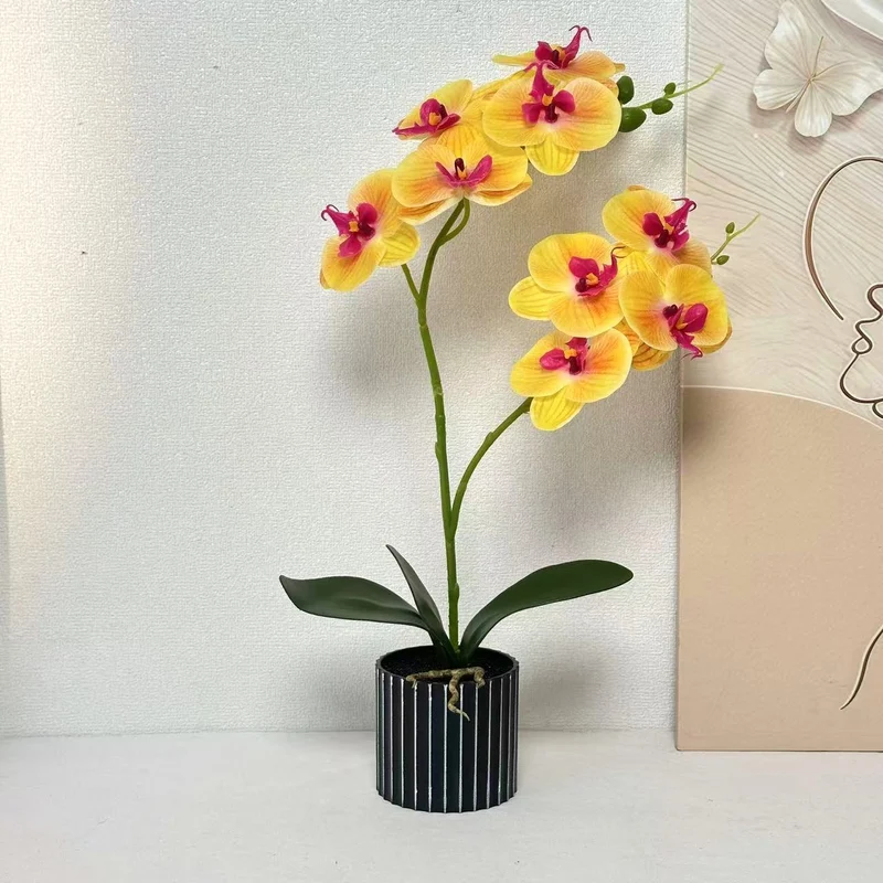 Künstliche Orchideenarrangement für die Innendekoration Zuhause