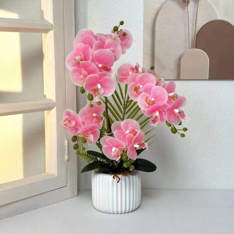 Künstliche Orchideenarrangement für dekorative Wohnbebilderung