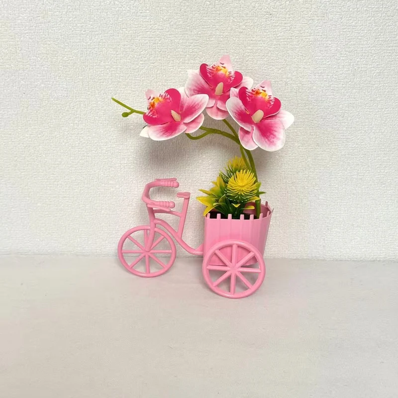 Dekorativer Fahrrad-Blumentopf mit Kunstorchideen-Arrangements für Dekor