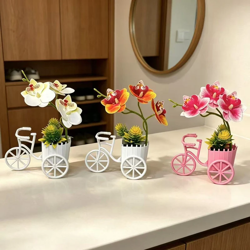 Dekorativer Fahrrad-Blumentopf mit Kunstorchideen-Arrangements für Dekor