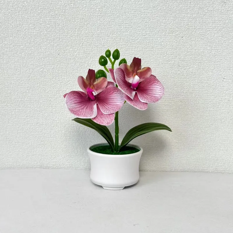 Elegante künstliche Orchideenpflanzenanordnung für die Innendekoration