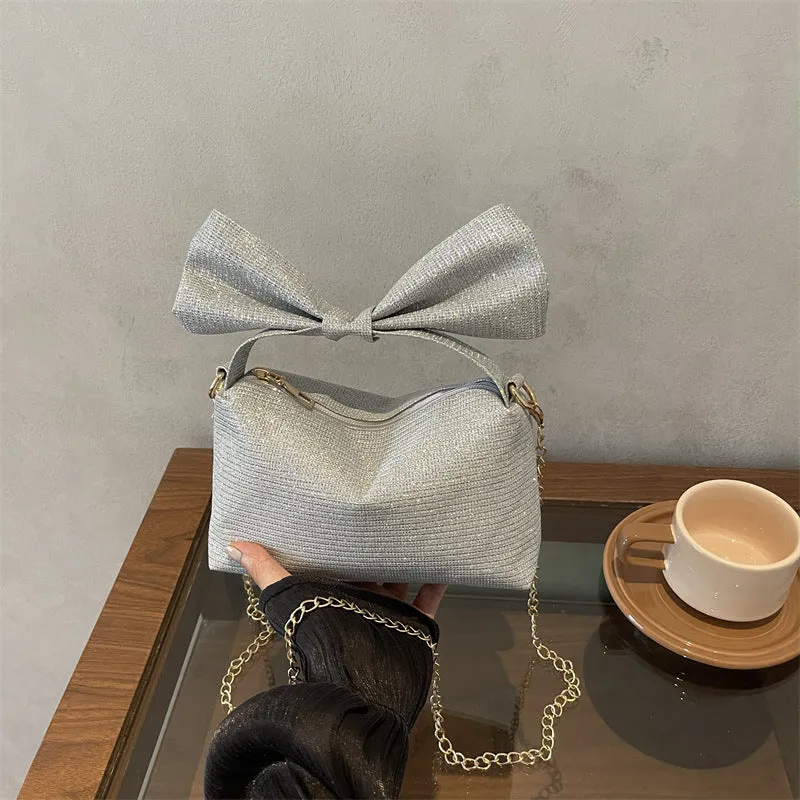 Bogen-accentuierte funkelnde Handtasche