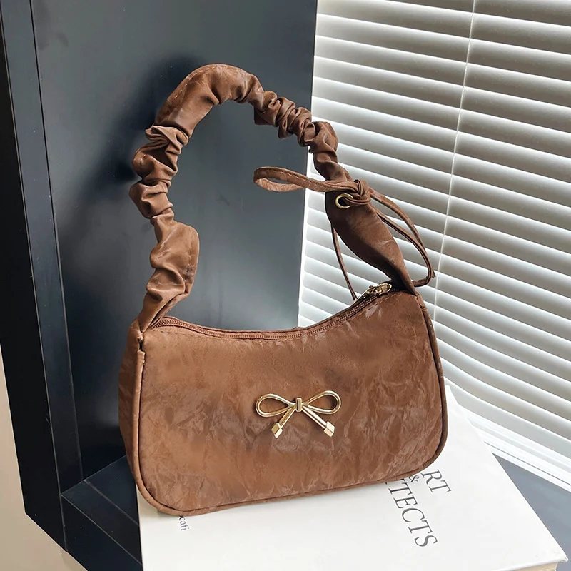 Elegante Schultertasche mit Schleifenverzierung
