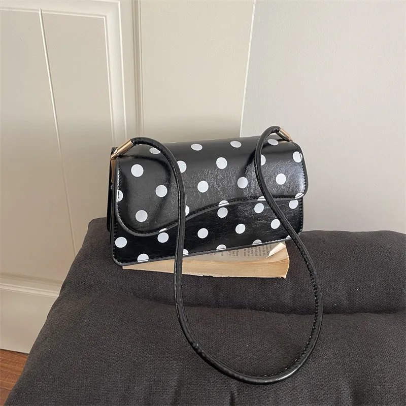 Schicke gepunktete Schultertasche