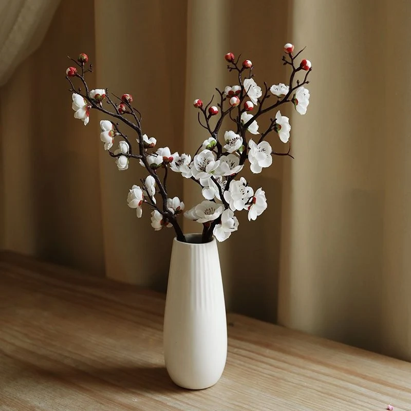 Dekorative Blumenäste Arrangement