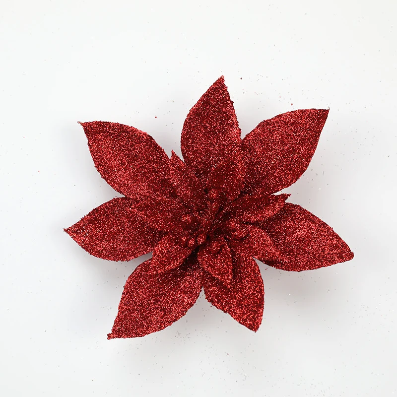 Glitzernde Weihnachtssternblumenornamente Karnz