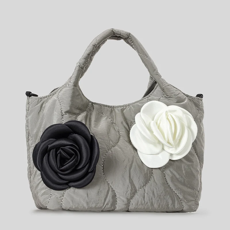 Blumengeschmückte gesteppte Handtasche