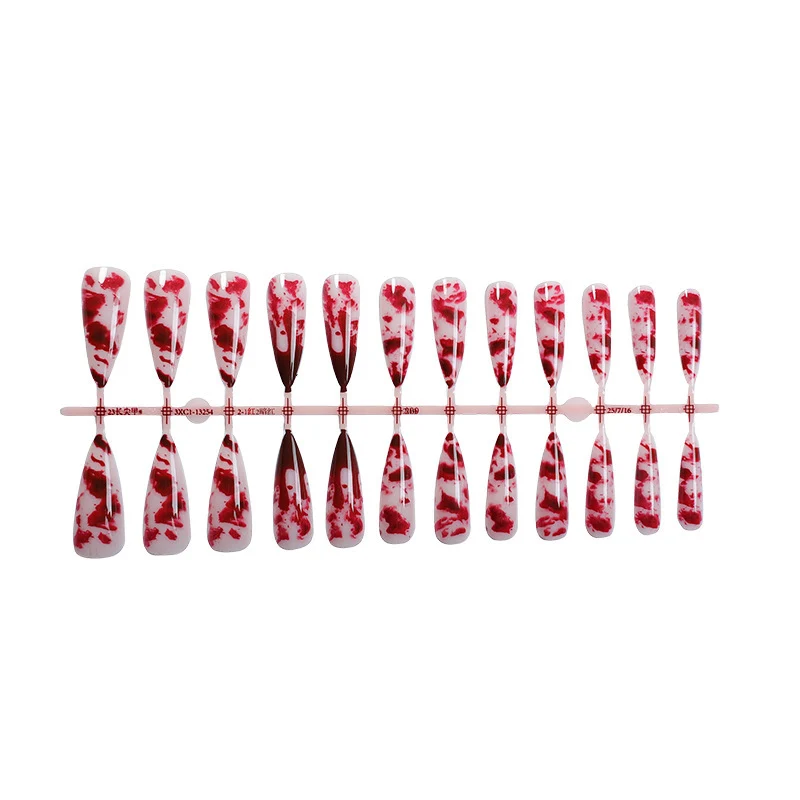 Künstlerisches Stiletto-Style Press-On-Nagelset mit Design von tropfendem Blut Karnz