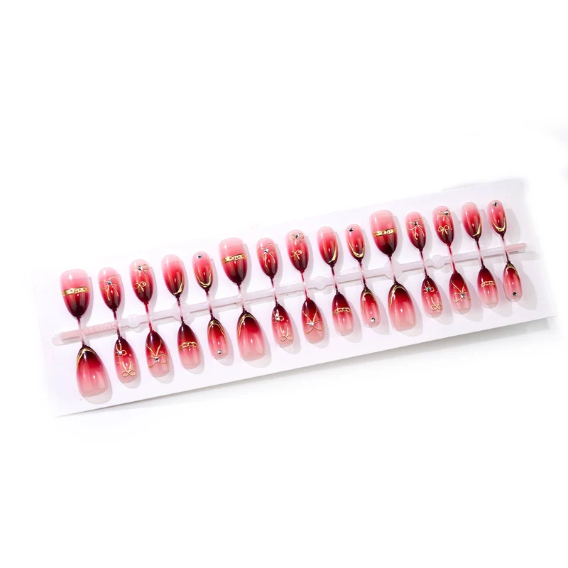 Künstlerisches Ombre Press-On Nail Art Set mit goldenen Akzenten Karnz