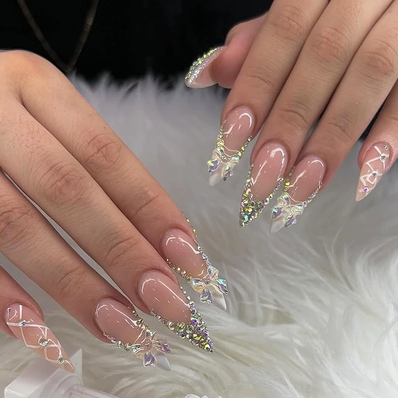 Kunstnagelset mit Glitzer- und Schleifenmotiv Karnz