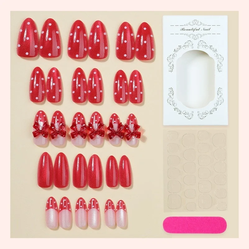 Kunstnagelset mit verspieltem Schleifen-Design und polka Punkte Karnz