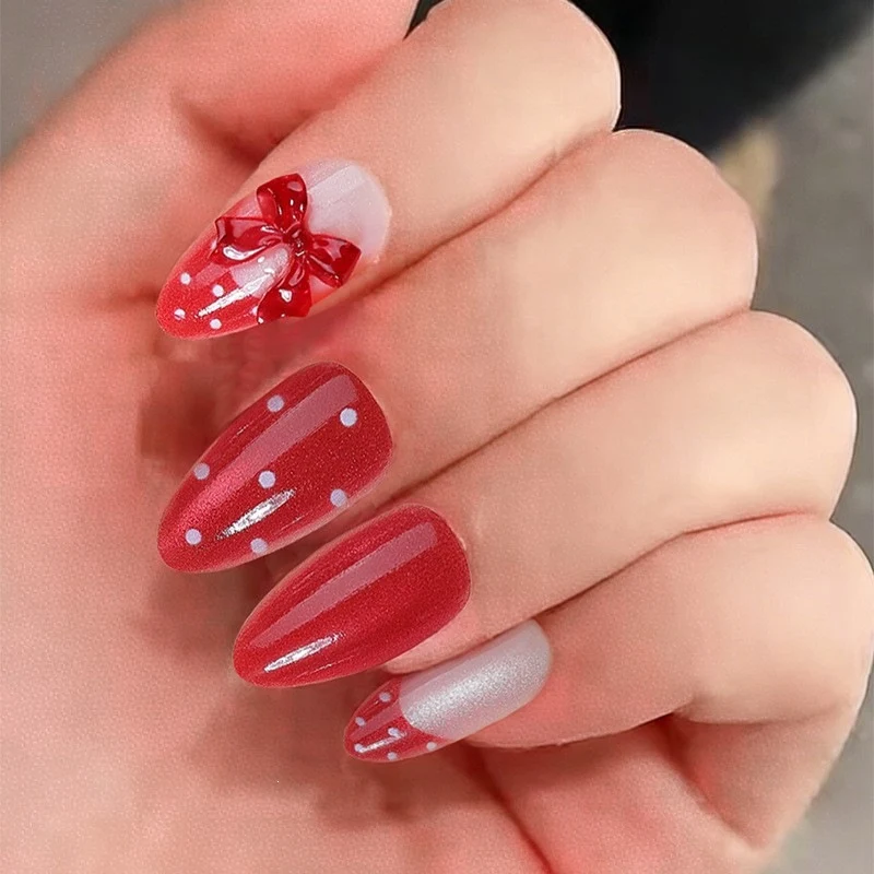 Kunstnagelset mit verspieltem Schleifen-Design und polka Punkte Karnz