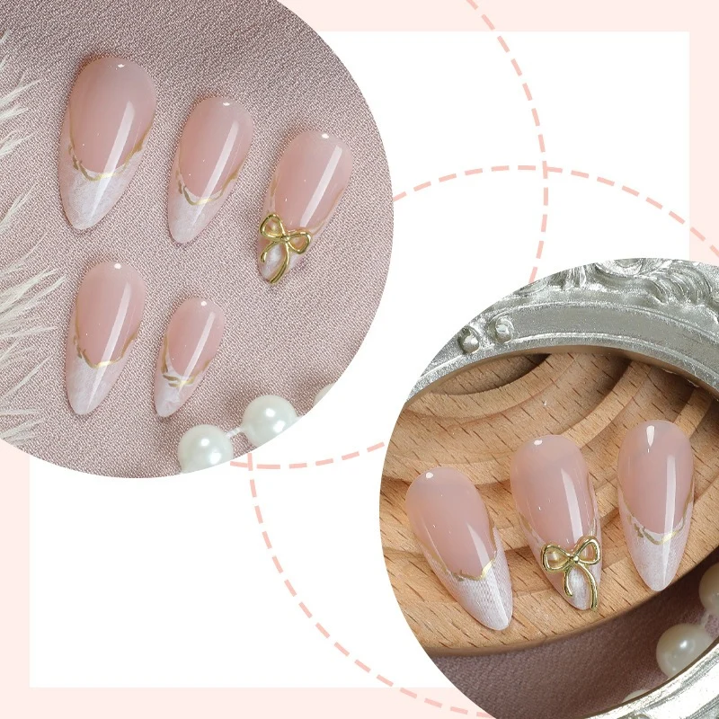 Kunstnagelset mit eleganten Spitzen und Goldverzierungen Karnz