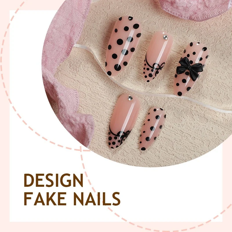 Kunstnagelset mit eleganten Punkte- und Schleifenmotiven Karnz