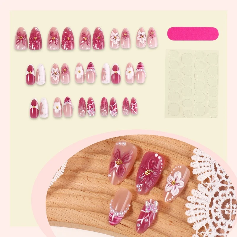 Kunstnagelset mit floralem Design und Glitzerakzenten Karnz