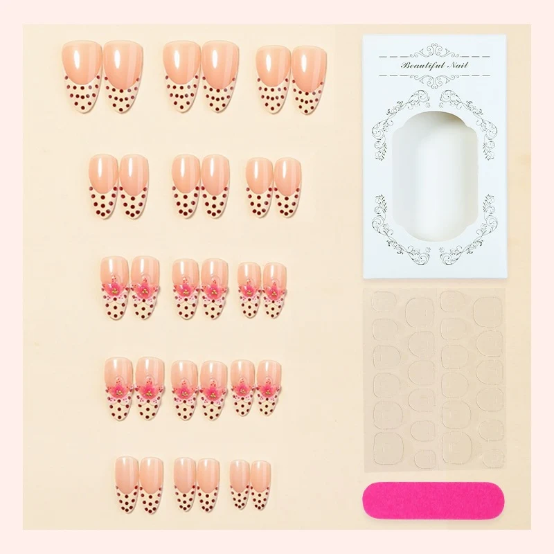 Kunstnagelset mit floralem Design und eleganten Punkten Karnz