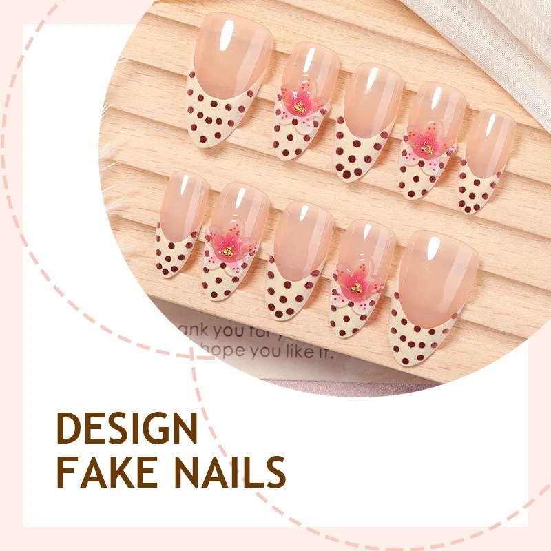 Kunstnagelset mit floralem Design und eleganten Punkten Karnz