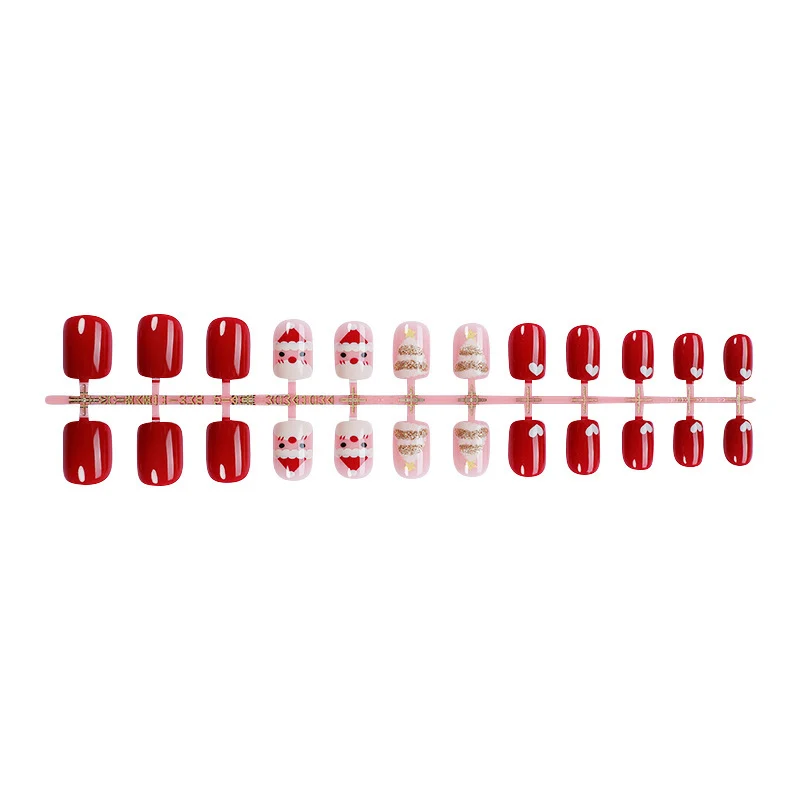Kunstnagelset mit festlichen Weihnachtsmotiven und Glitzerakzenten Karnz