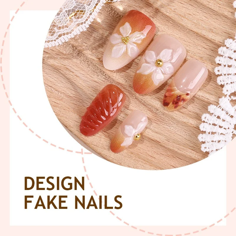 Kunstnagelset mit eleganten Blumen- und Herbstmotiven Karnz