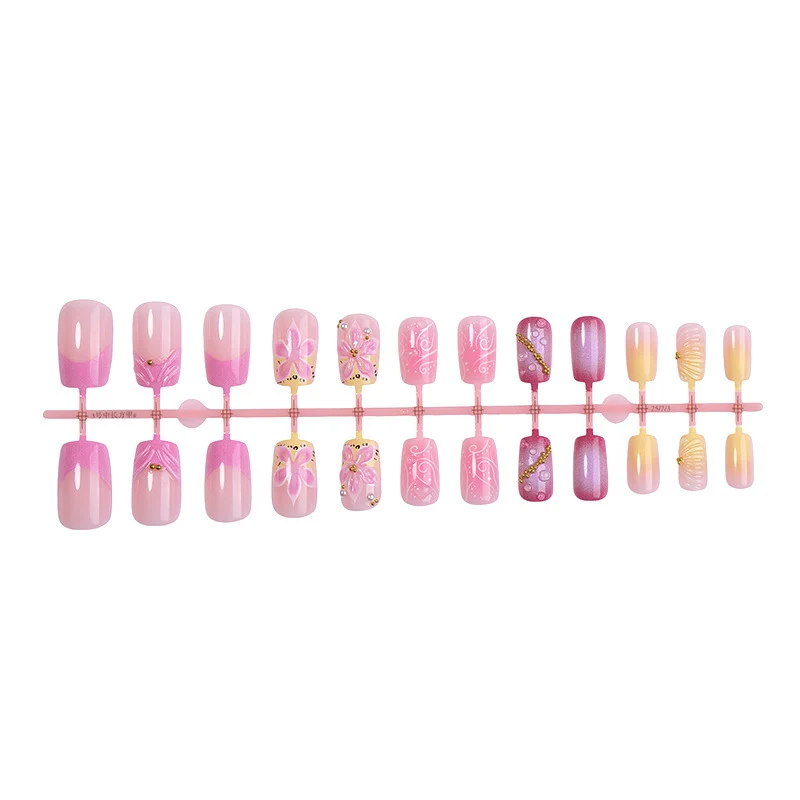 Künstliche Nagelkollektion mit floralem Design und Glitzerakzenten Karnz