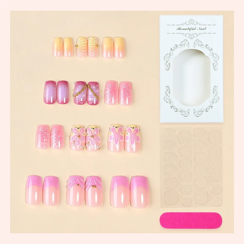 Künstliche Nagelkollektion mit floralem Design und Glitzerakzenten Karnz