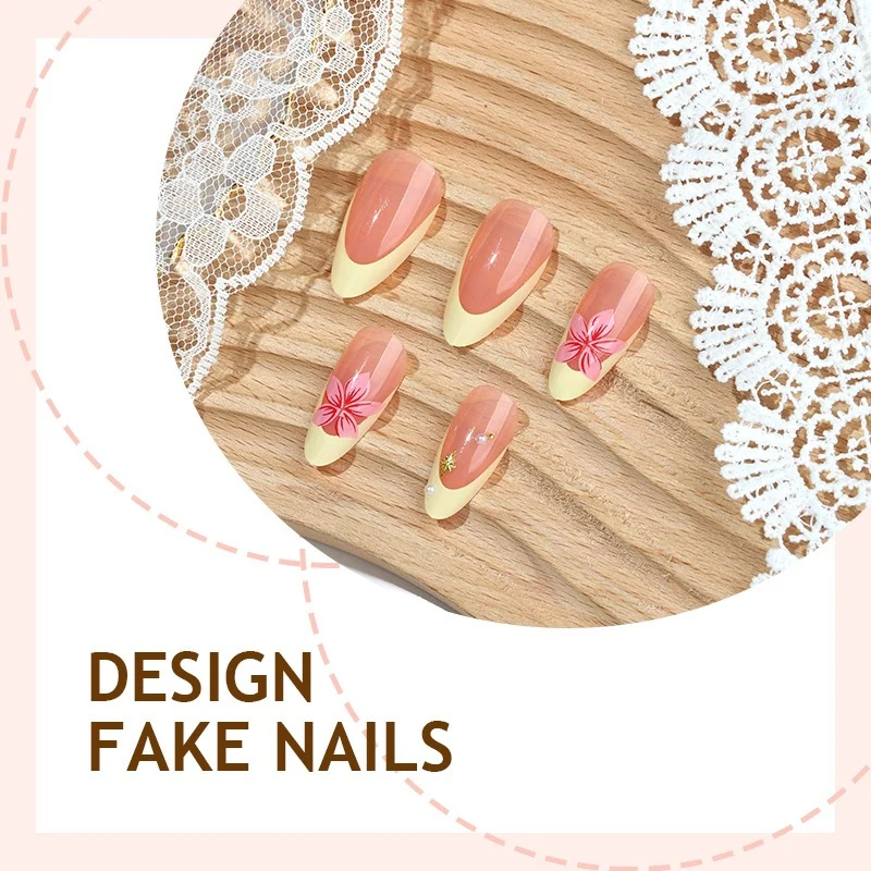 Künstliche Nagel-Kollektion mit floralen Akzenten und eleganten Verzierungen Karnz
